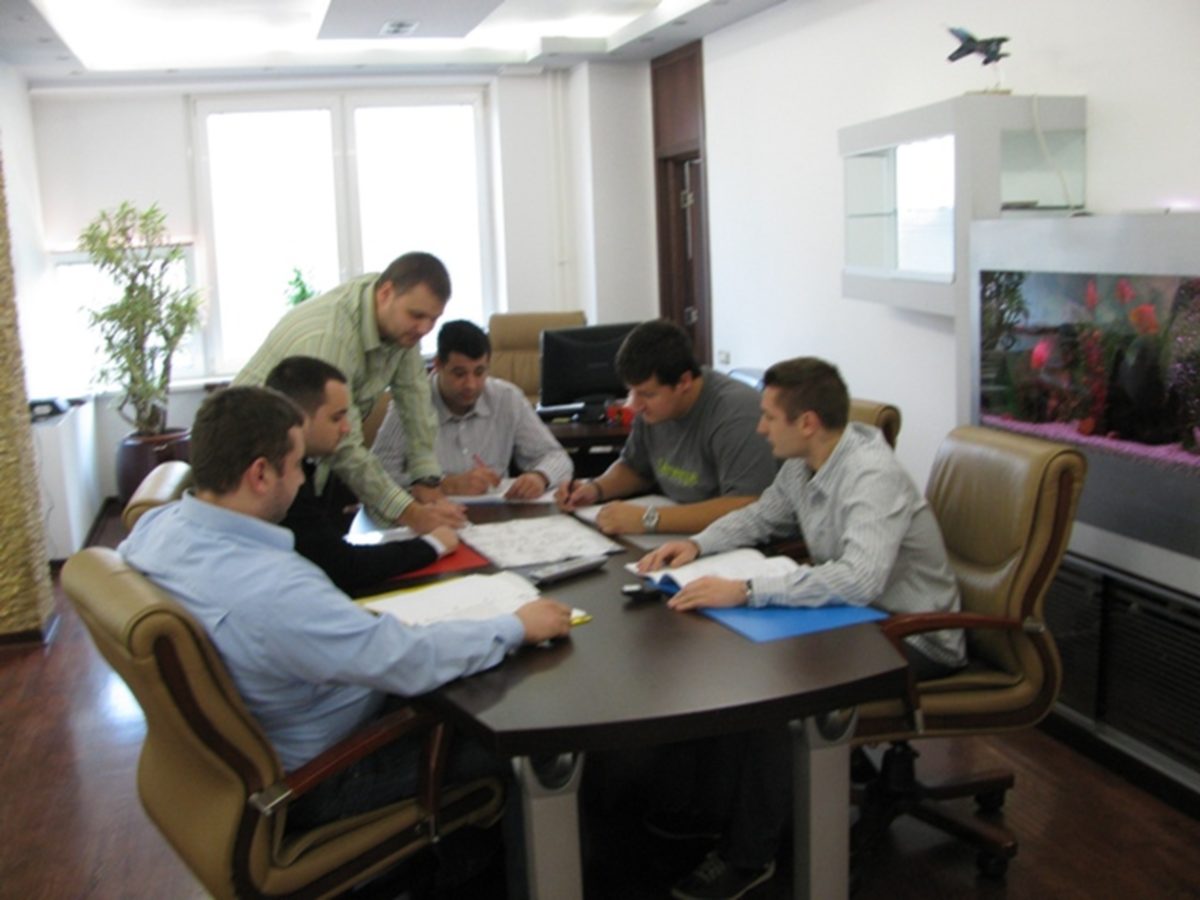 TGT team reviewing engineering drawings together